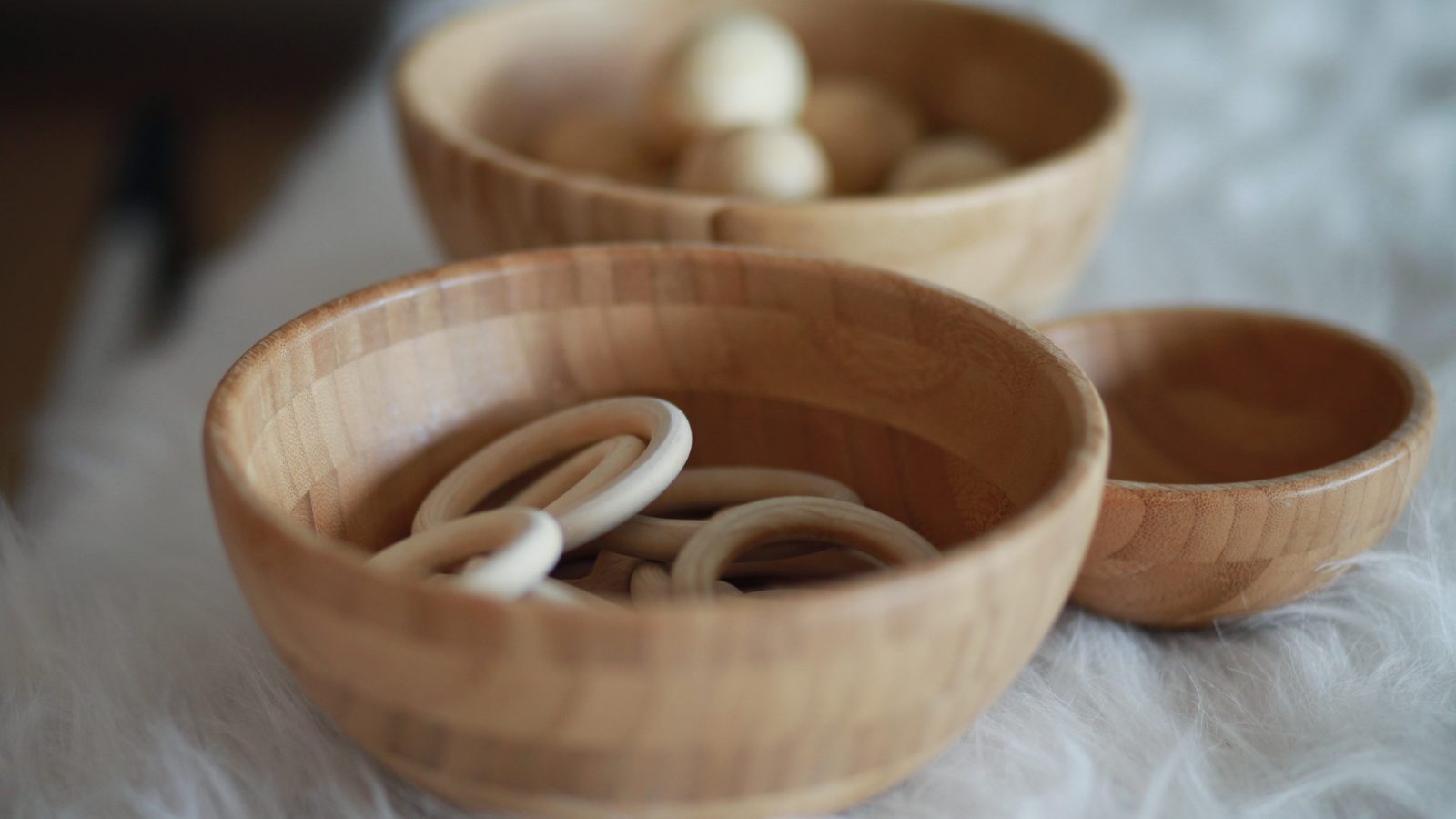 Bowl with wooden sensory materials for baby classroom